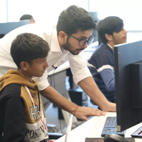 Faculty helping a student in the chatbot session