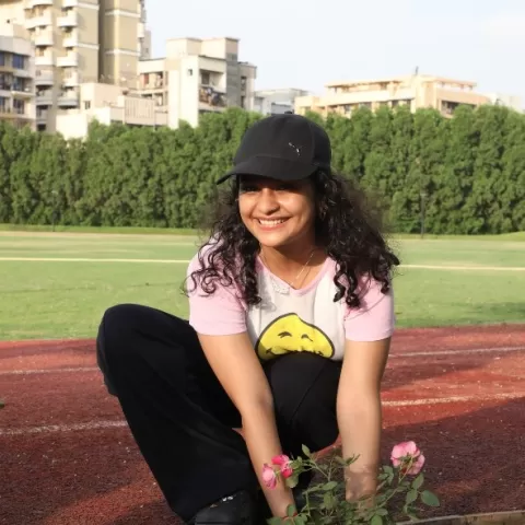 Student planting a sapling