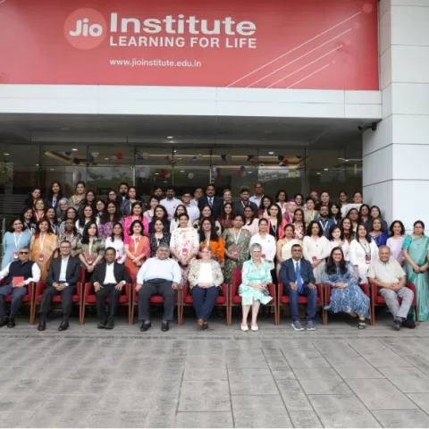 Participants and staff pose before the Programme