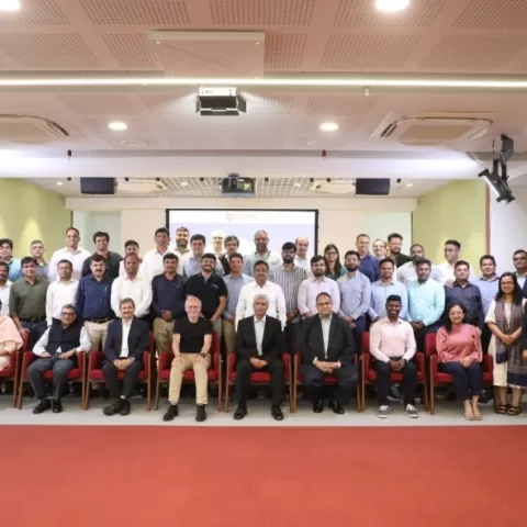 Participants and guests pose after the session