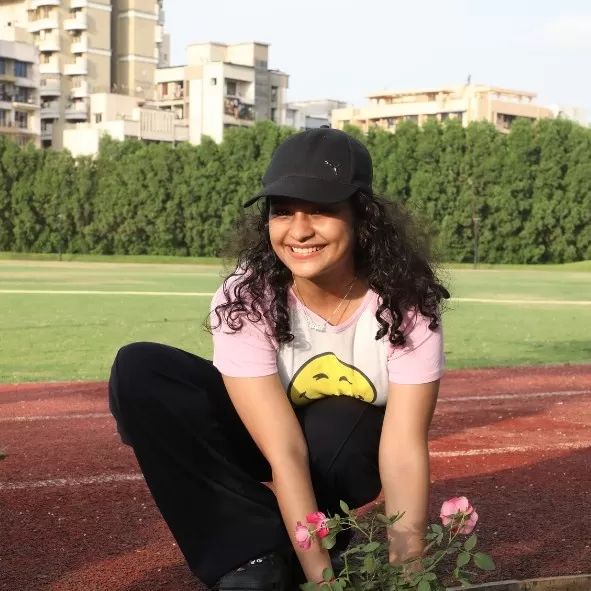 Student planting a sapling