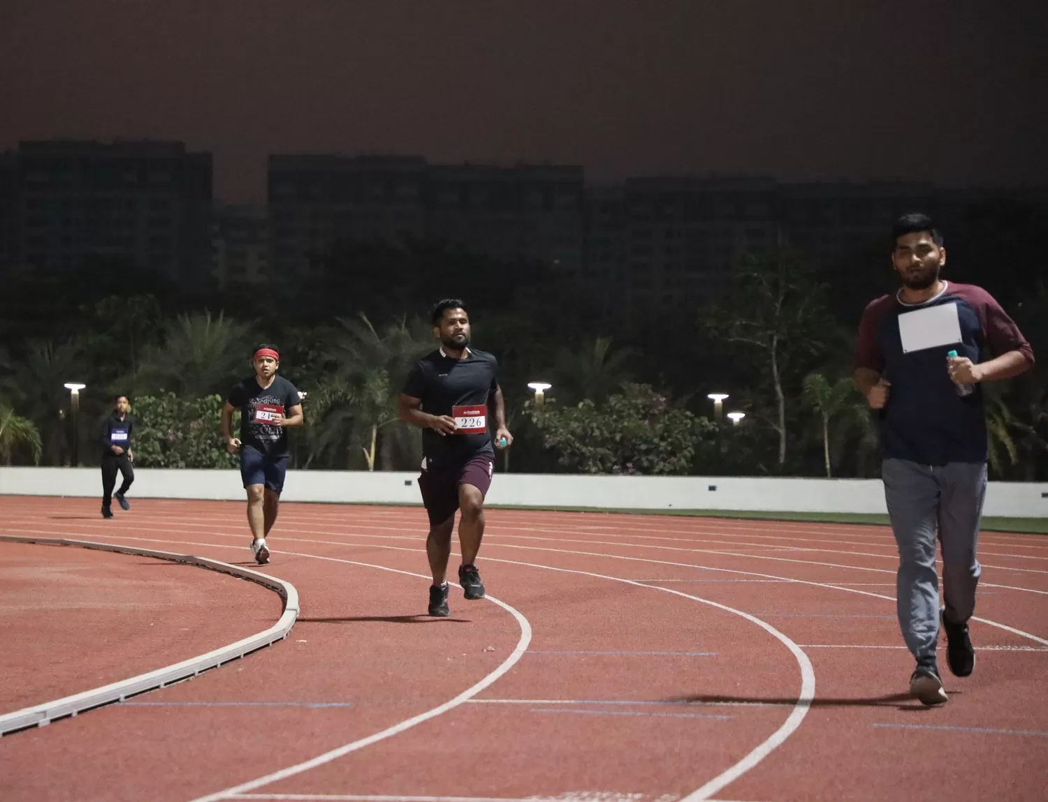 Participants running in the track