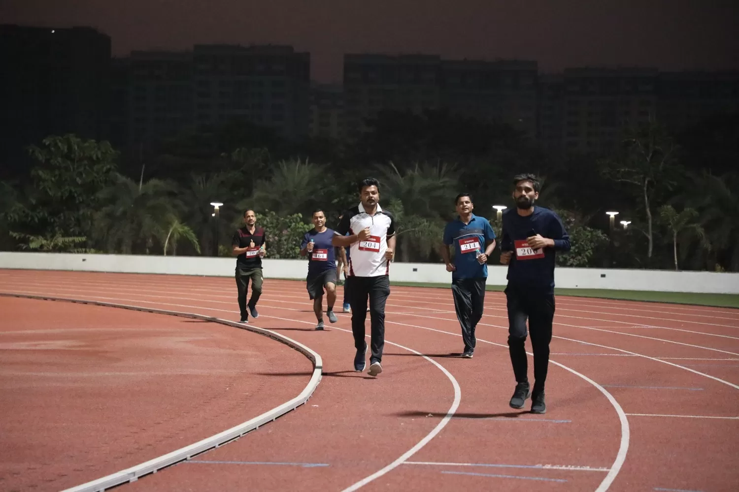 Participants running in the track