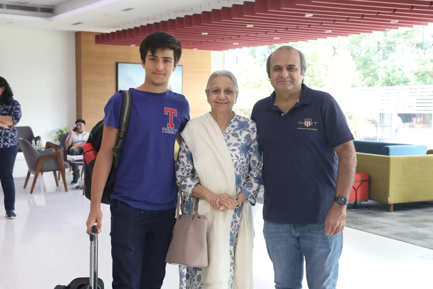 Student checking in accompanied by family